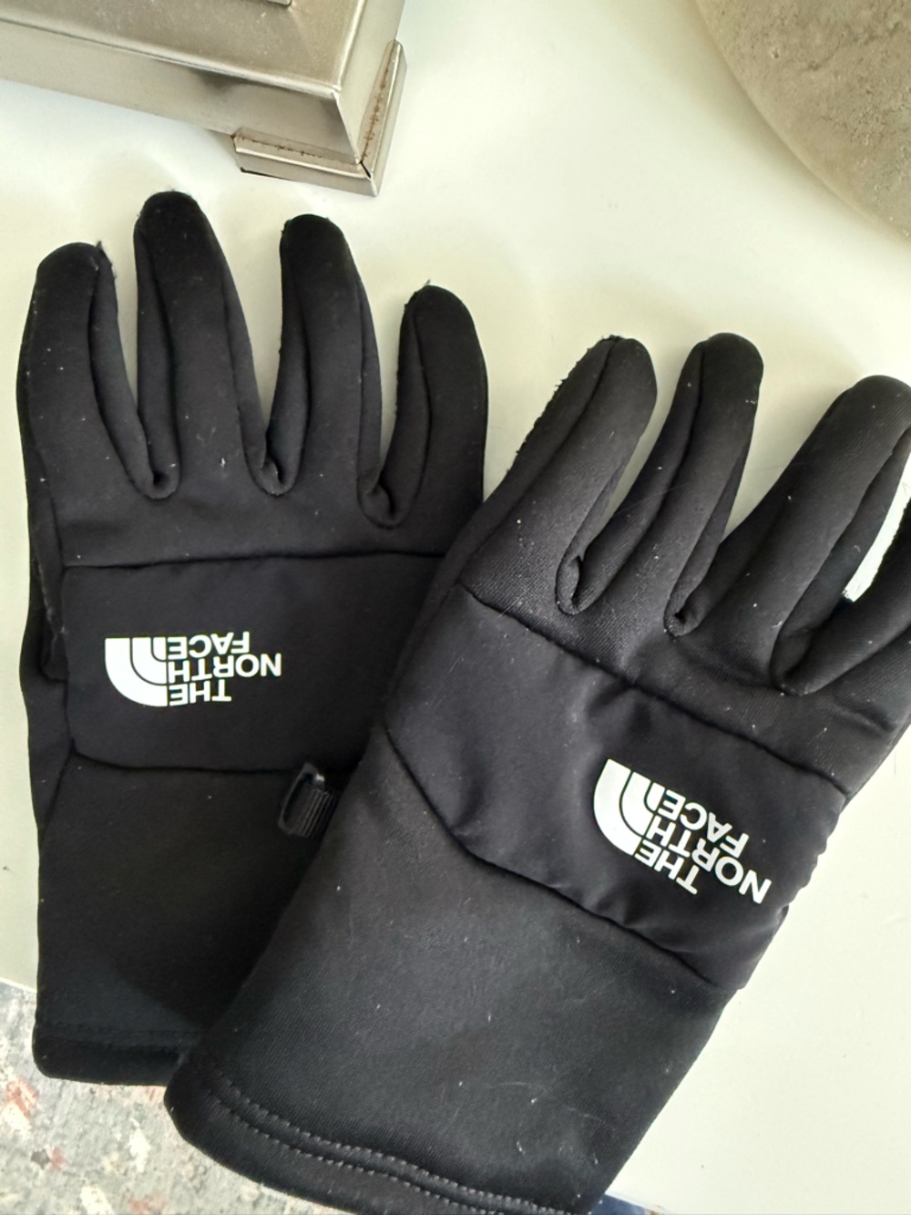 Black North Face Gloves size M youth.